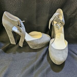 Grey suede block heeled shoe.